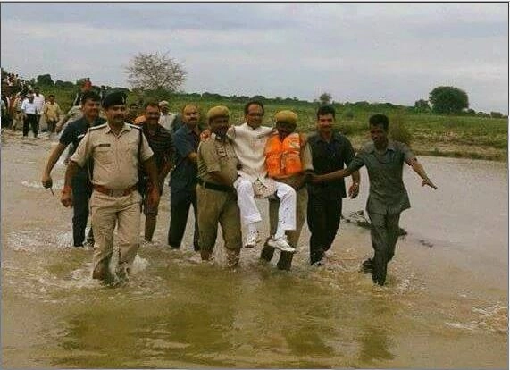 CM Shivraj drew flak as cops lift him in flooded area