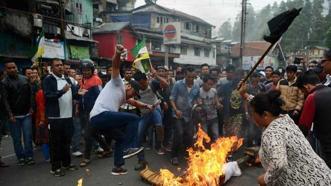 Gorkha activists burn GTA agreement in front of security forces