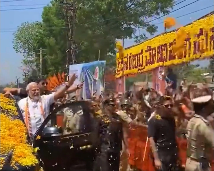 WATCH - People shower PM Modi with flowers as he holds roadshow in poll-bound Karnataka