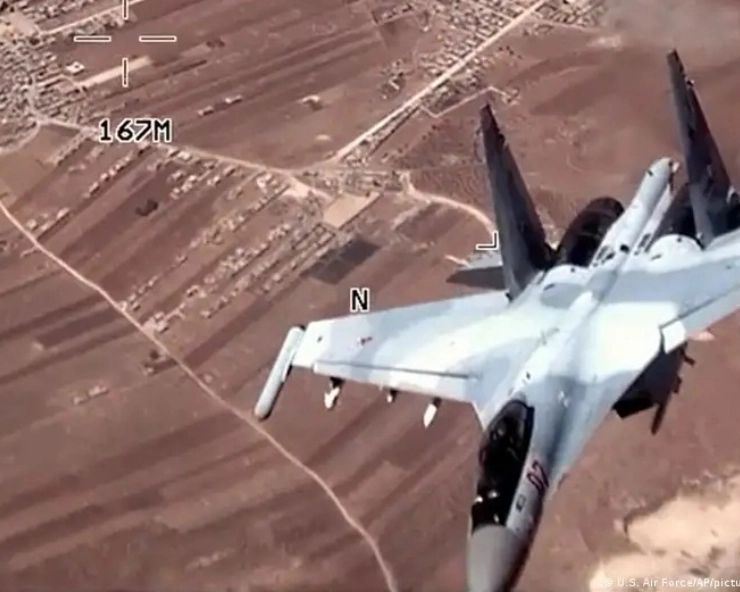 A picture from the drone showing a Russian fighter jet flying close by above fields and villages in Syria