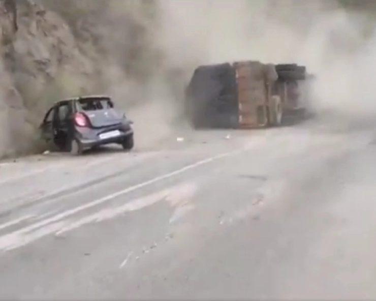 VIDEO: 4 people narrowly escape multiaxle truck turning turtle after tyre burst near Shimla