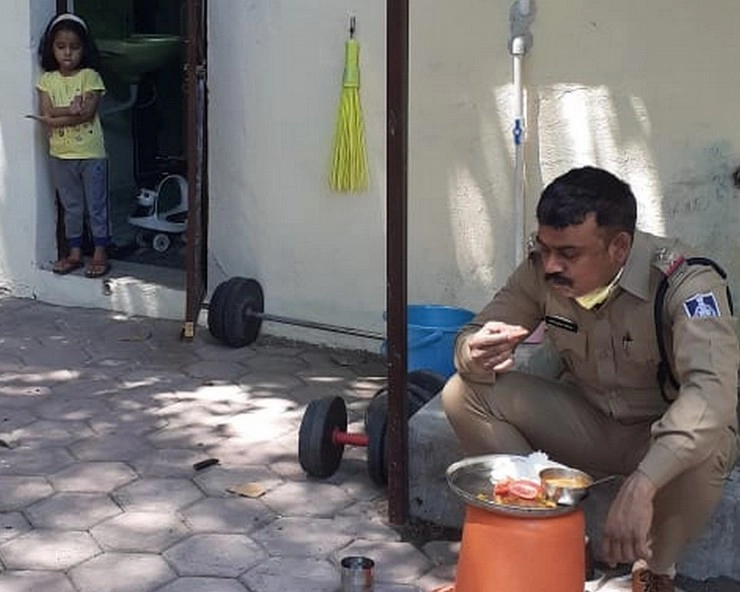 इंदौर में पिता और बेटी के बीच Corona की दीवार, घर के बाहर TI पिता को खाना खाते देख मासूम बेटी की तस्वीरें वायरल - Corona wall between father and daughter in Indore
