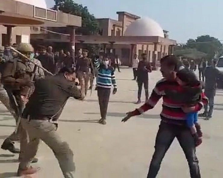 कानपुर देहात में दरोगा ने बरसाई लाठियां, बच्‍चे को गोद में उठाए युवक लगाता रहा गुहार... - In Kanpur countryside, the daroga beat up the youth with a stick