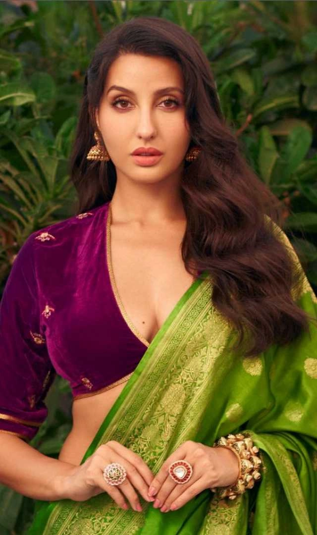 Nora Fatehi Steps Out In A Green Saree And Textured Blouse For