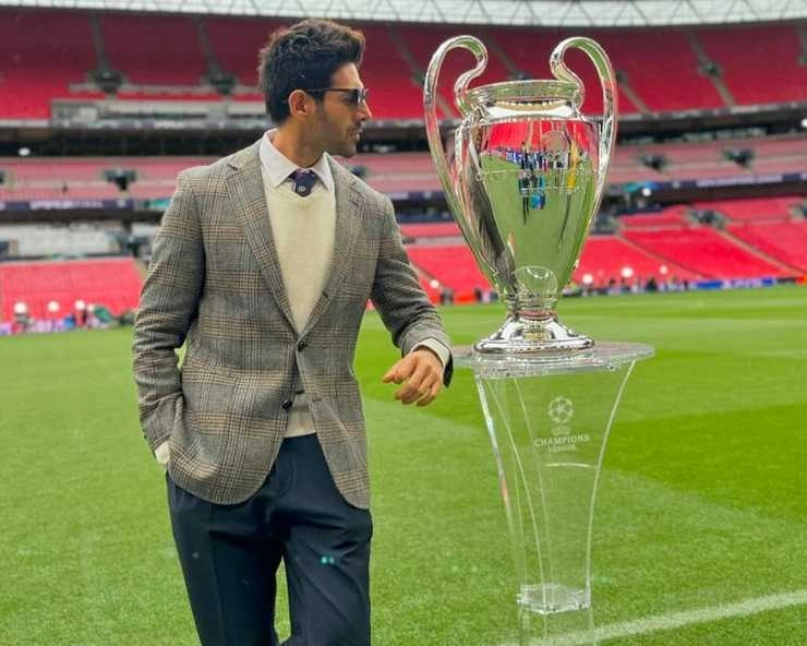 chandu champion actor Kartik Aaryan strikes a pose with the 2024 UEFA Champions League Trophy - chandu champion actor Kartik Aaryan strikes a pose with the 2024 UEFA Champions League Trophy