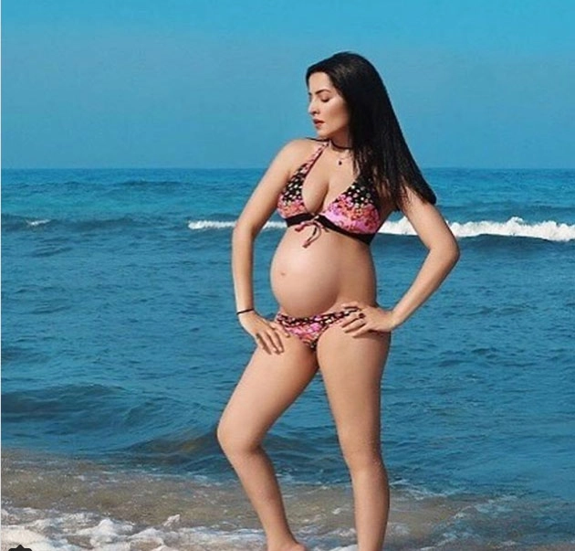 Bikini clad Celina shows her baby bump