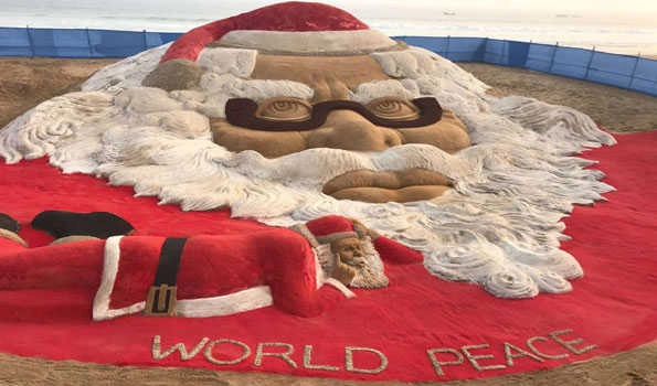 Sand artist Sudarshan creates world’s biggest sand santa face on Puri beach
