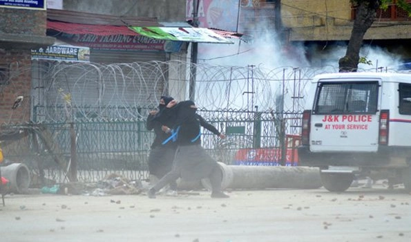 Security force burst teargas shells to disperse demonstrators in Shopian