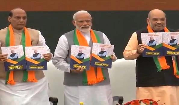 PM unveils BJP manifesto with theme  'Nation first',  pledges to take nation to new heights