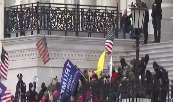 Police retake control of US Capitol after rioters stormed the halls of Congress to block Biden's win