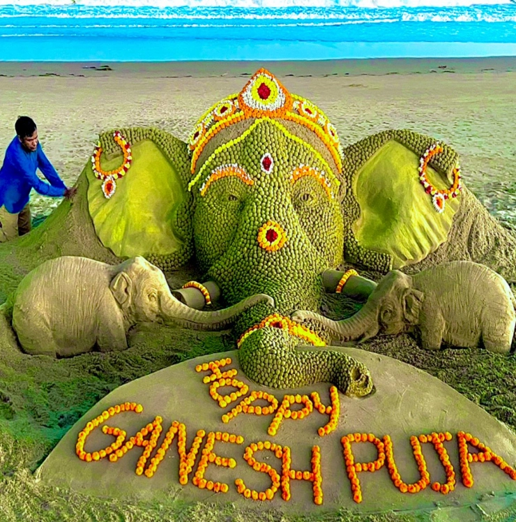 Sand artist Sudarshan uses 3,425 sand ladoos to create Ganesh at Puri beach
