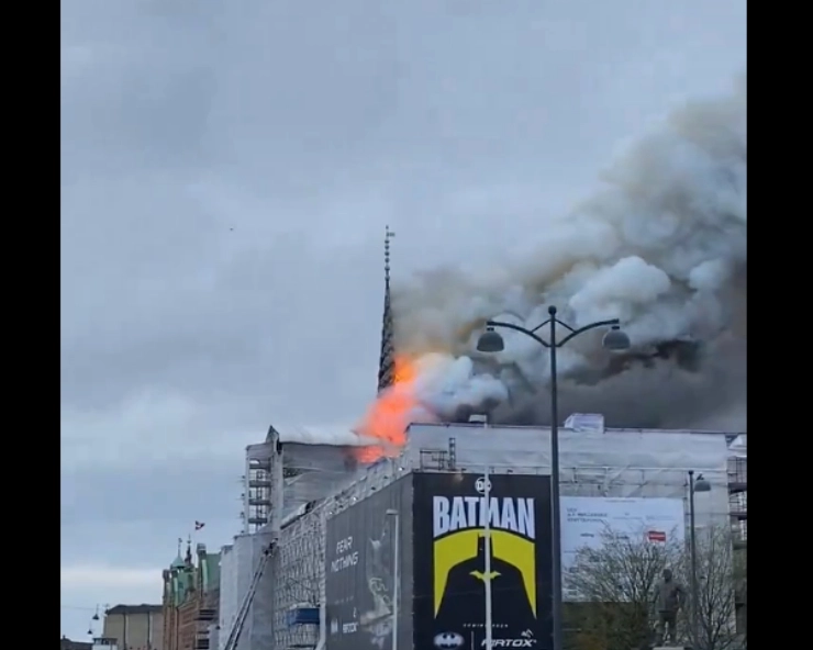 Fire at Copenhagen's 17th-century old stock exchange building, iconic 54-meter spire collapses; locals scramble to rescue historical paintings from blaze - WATCH