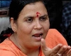 नई शराब नीति पर बवाल, उमा भारती ने शराब की दुकान के सामने मंदिर में डाला डेरा