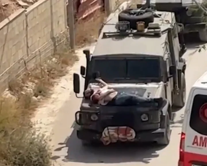 VIDEO: Israeli military ties injured Palestinian man to jeep during West Bank arrest