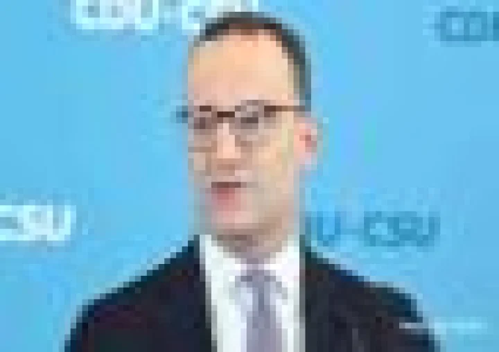 Why did Merz ally Jens Spahn's surrogacy spark debate in Germany?