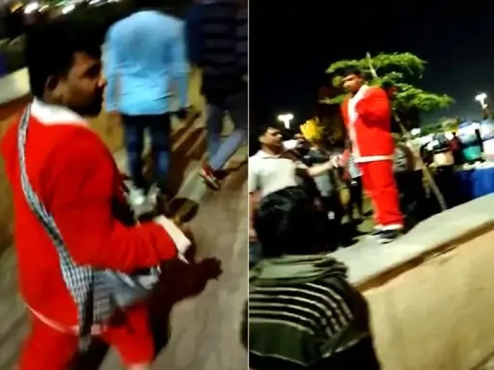 A video of people hitting Santa Claus
