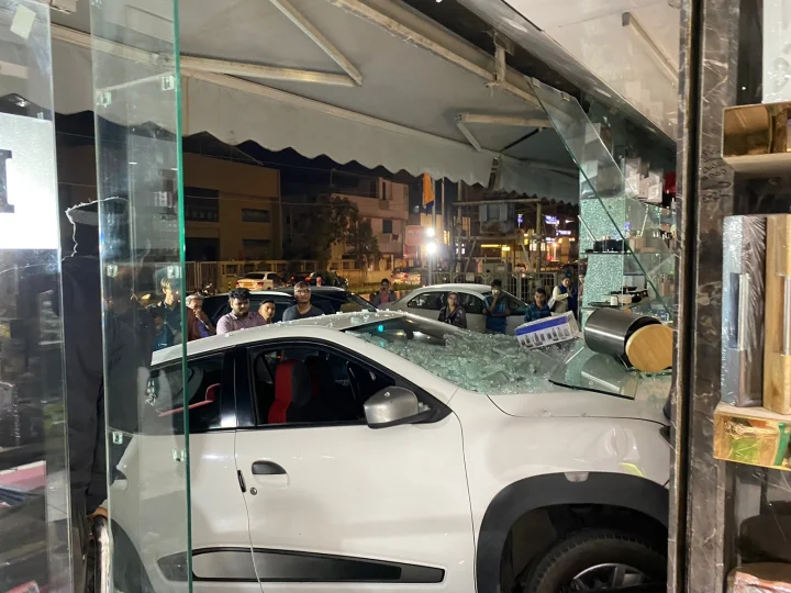 In Vadodara, woman presses accelerator instead of brake, car bounces, jumps 5 steps...breaks glass and enters showroom