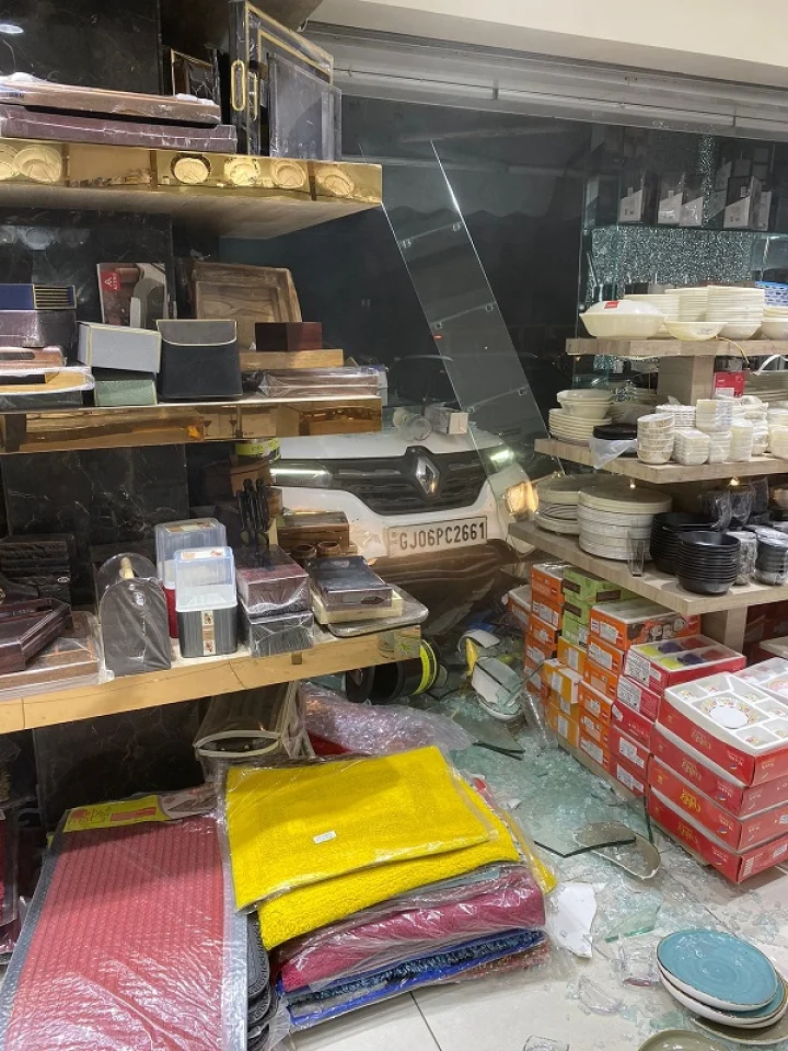 In Vadodara, woman presses accelerator instead of brake, car bounces, jumps 5 steps...breaks glass and enters showroom
