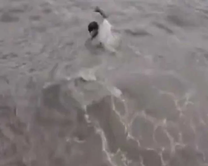 Viral video man swim in beach