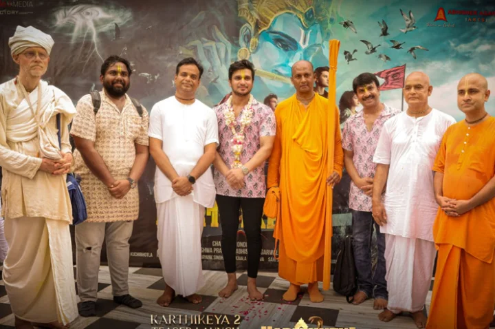 Karthikeya 2 team with ISKCON Vice President Radha Ramdas