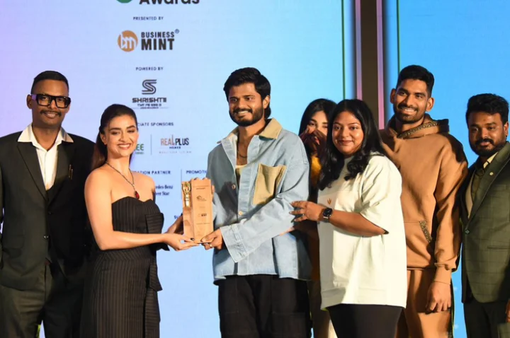 Anand Devarakonda receiving Rowdy Wear Out Look award