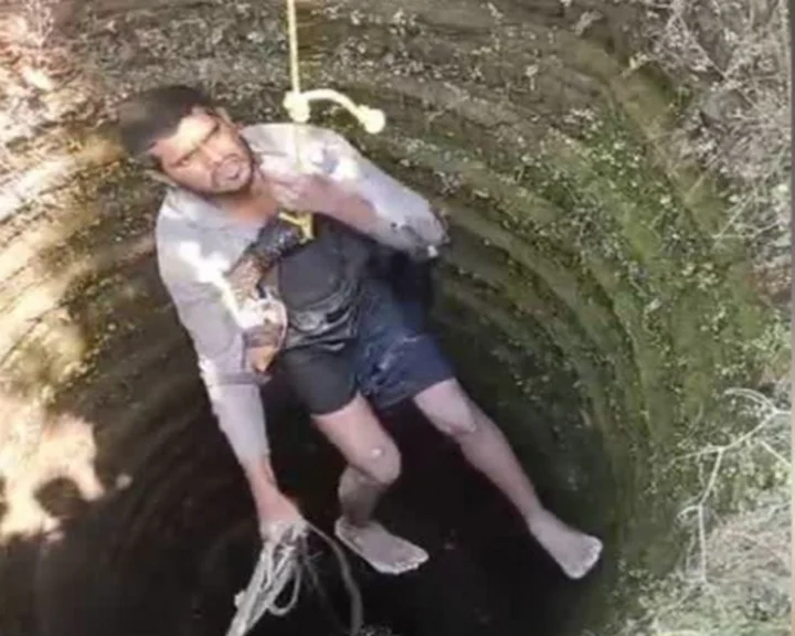 man in well