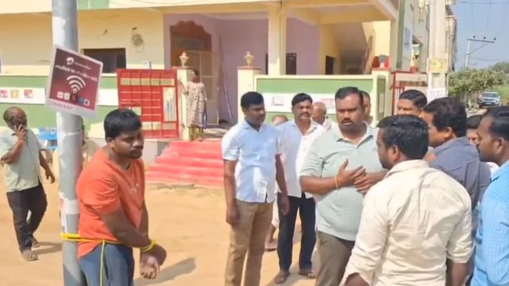 man tied to poll
